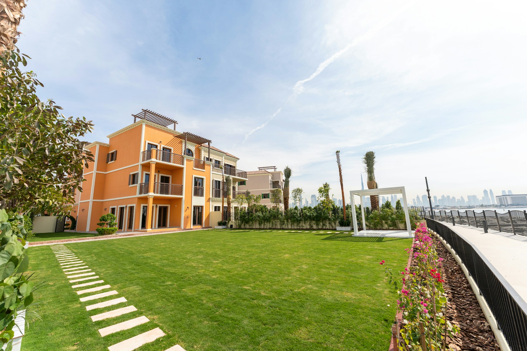 Premium Dubai waterfront villa with manicured grounds and skyline